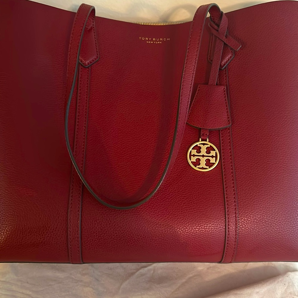 PERRY TRIPLE-COMPARTMENT TOTE BAG. Color is Brick (a deep red, not a bright red)